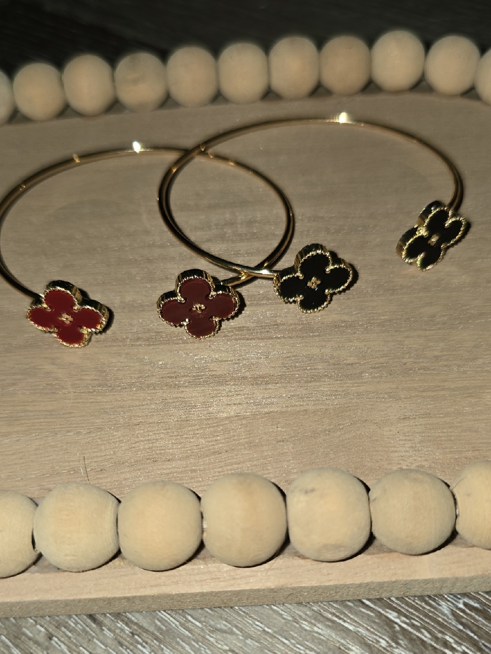 Gold-Plated Hoop Bracelet with Red and Black Clover Charms